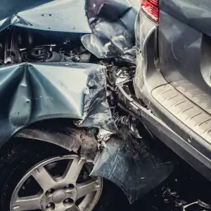 Rear-end collision showing severe vehicle damage after a car accident