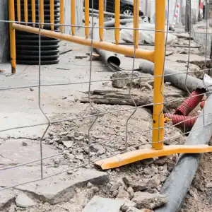 Outdoor stairway blocked by fallen rubble and damaged appliance