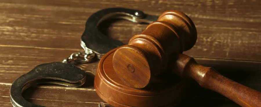 Wrongful Conviction: closeup view brown wooden mallet judge
