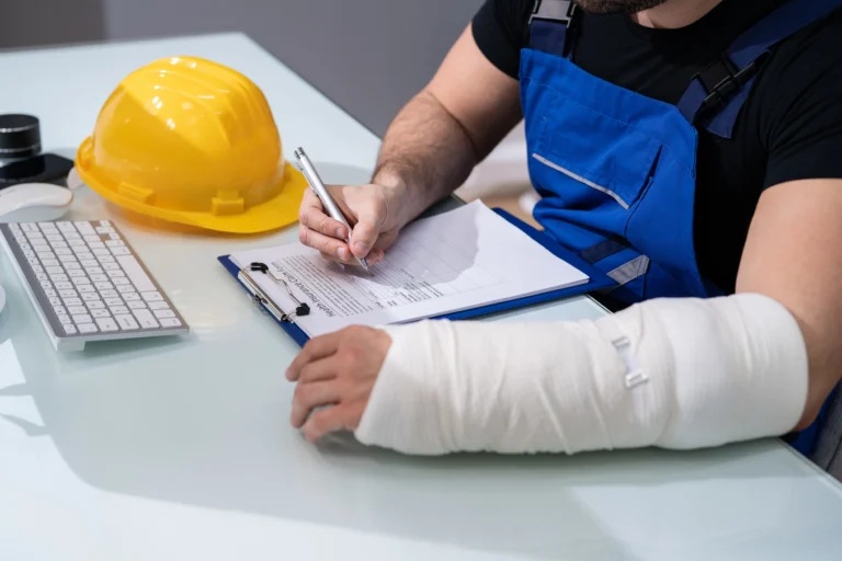 Construction Accident: engineer working construction projecthelmet laptop table-scaled